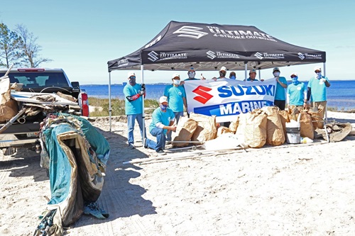 SUZUKI MARINE CREW WORKS TO CLEAN UP PANAMA CITY, FLORIDA COASTAL AREA 